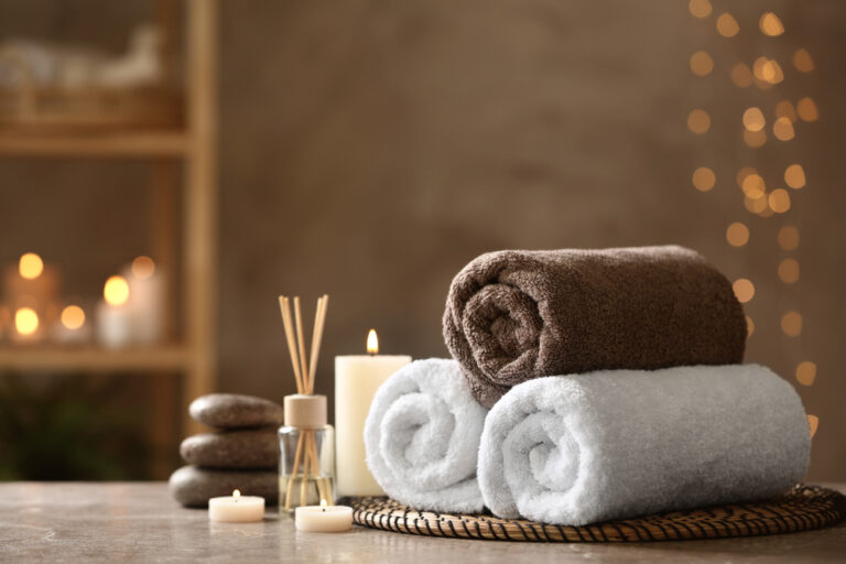 Beautiful,Composition,With,Spa,Stones,On,Grey,Marble,Table